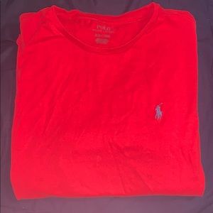 Red polo shirt w/blueish black horse